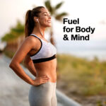 Person standing outdoors after a workout, listening to music and breathing deeply with the text “Fuel for Body & Mind.” Represents an active lifestyle supported by MuscleTech supplements designed to enhance physical performance and mental focus.