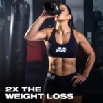 Person drinking from a MuscleTech shaker bottle in a gym environment with text overlay “2X The Weight Loss.” Represents active lifestyle and the performance benefits of MuscleTech Nitro-Tech Ripped protein formula.